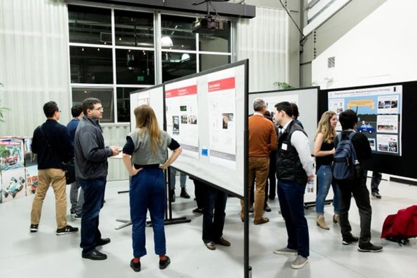 Event participants at a poster session